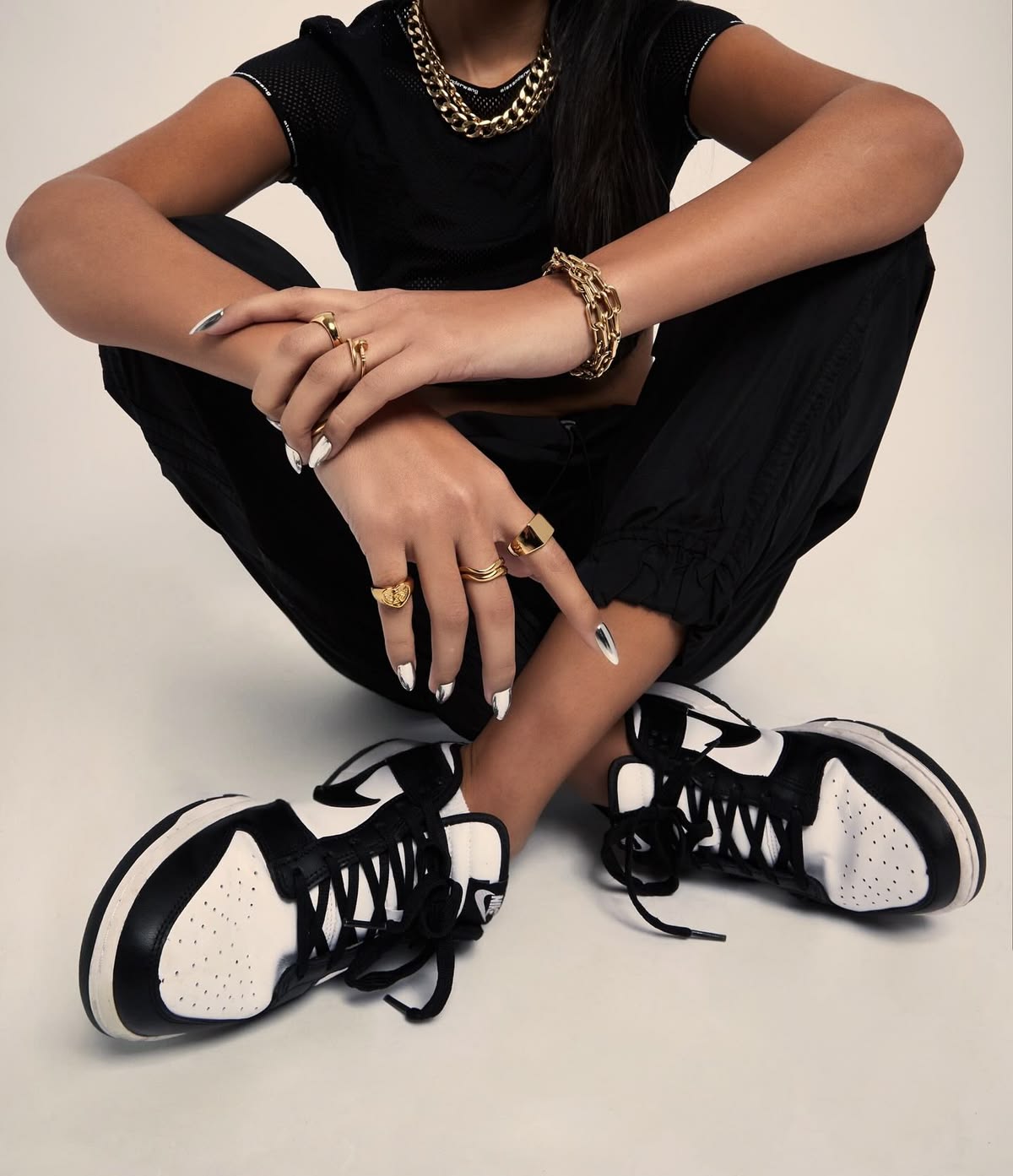 Sneakers meet statement gold